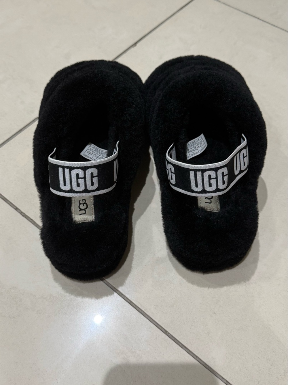 UGG women’s Black Fluff Slide with Logo Strap